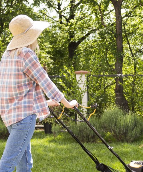 long-shot-woman-mowing-grass-scaled-e1721817919148.jpg